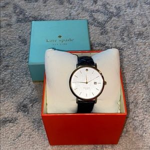 black leather band with white analog dial watch